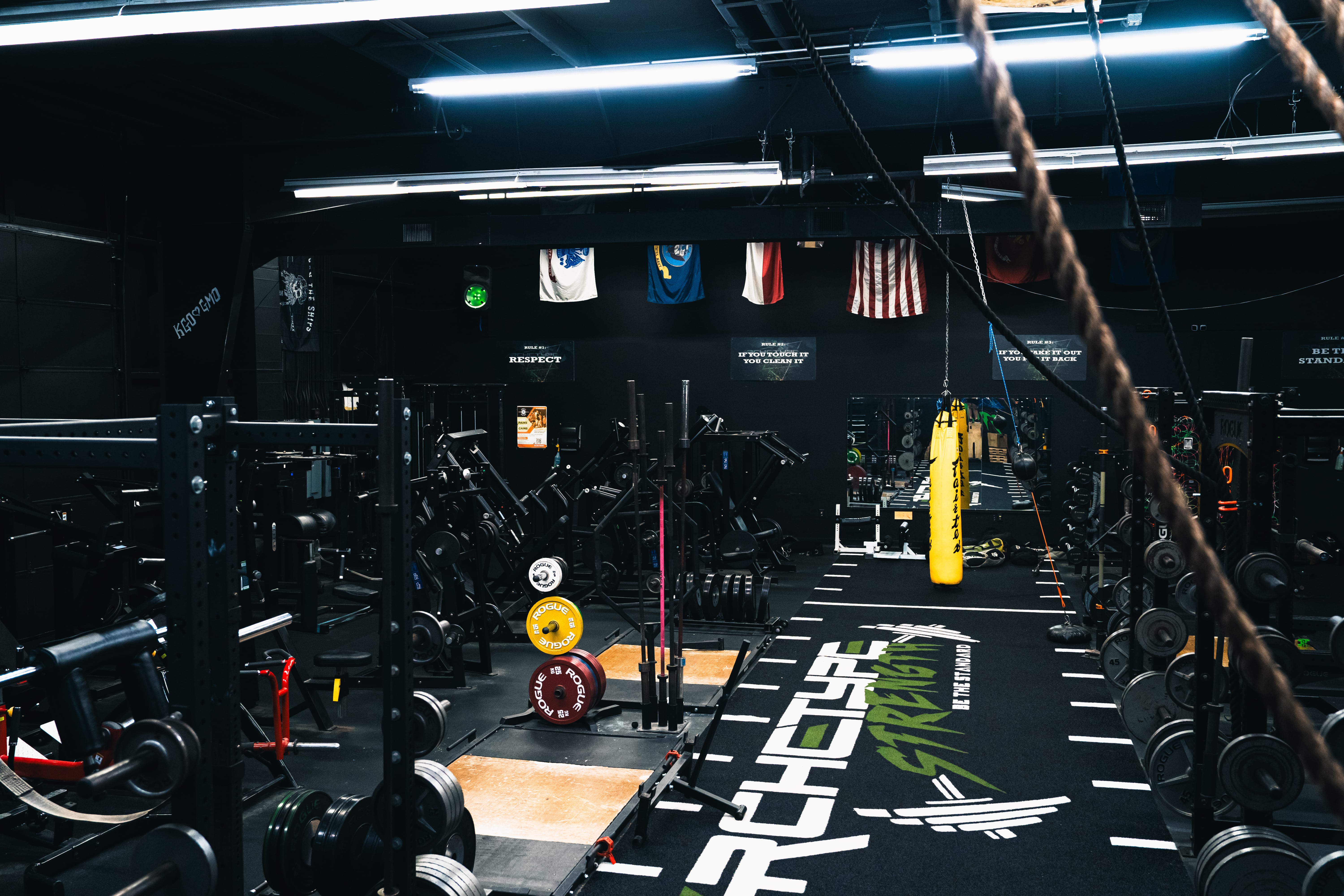 Squat racks and weight plates at Archetype Strength in Raleigh NC